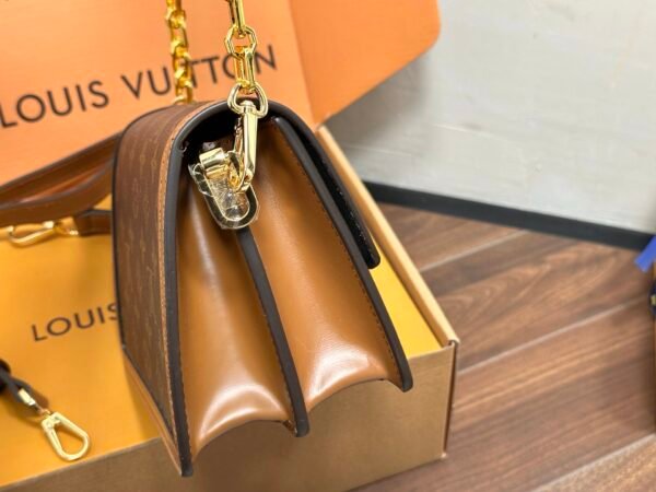 LV Daphine Messenger Bag, made of full-grain cowhide.