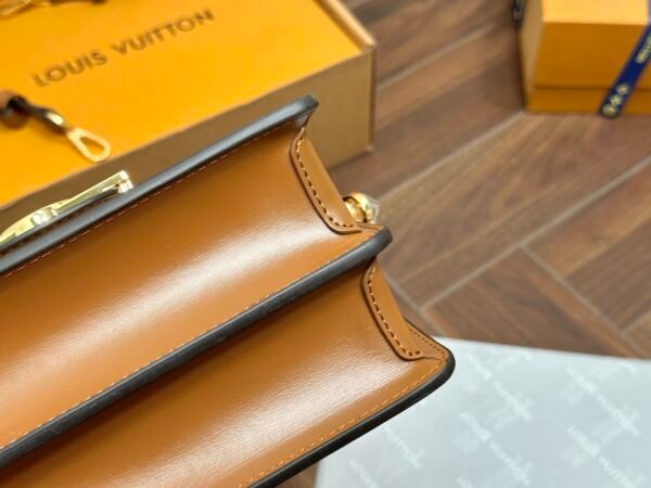 LV Daphine Messenger Bag, made of full-grain cowhide.